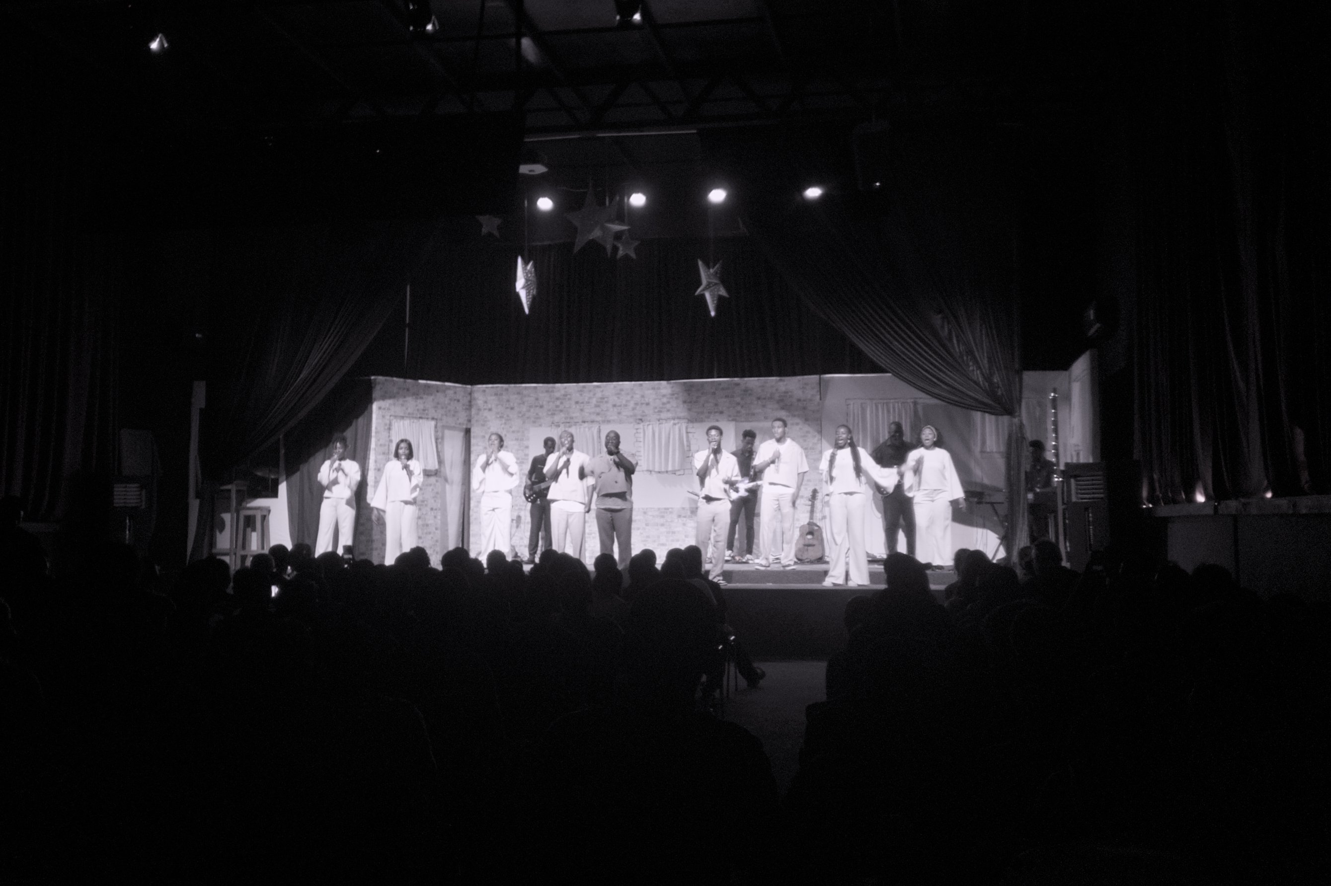 black and white picture of singers on a stage